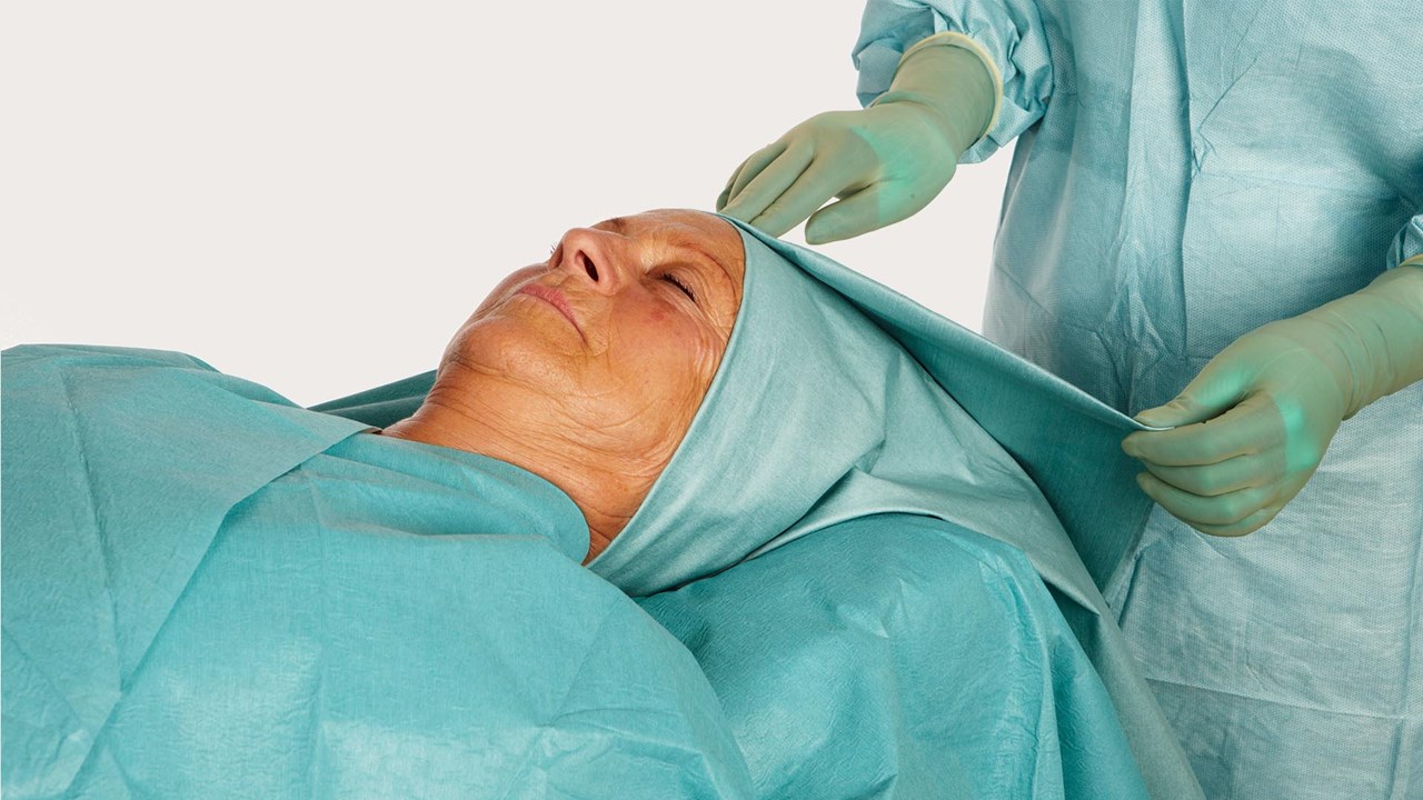 head of a female patient draped in barrier ent drape