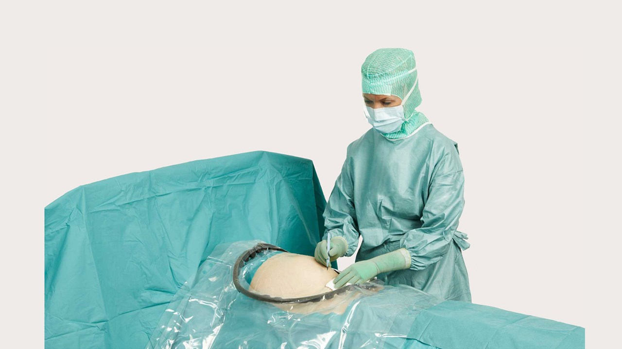 a female surgeon using BARRIER® obstetric drapes