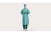 a male clinician wearing BARRIER surgical gown classic