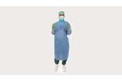 a male clinician wearing BARRIER surgical gown Universal
